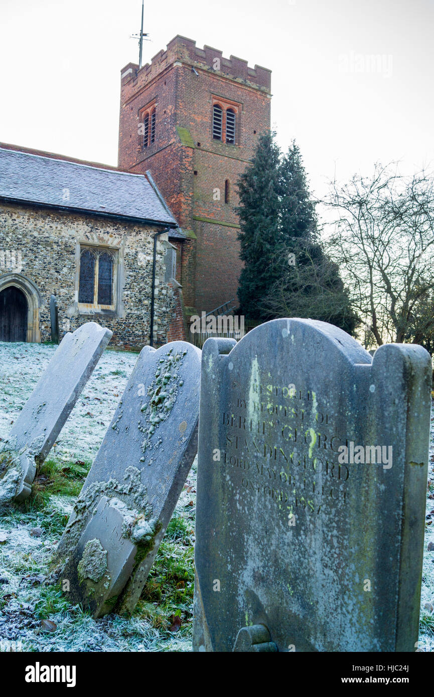 Gravestones in frost, All Saints' Church, Nazeing, Essex, England Stock