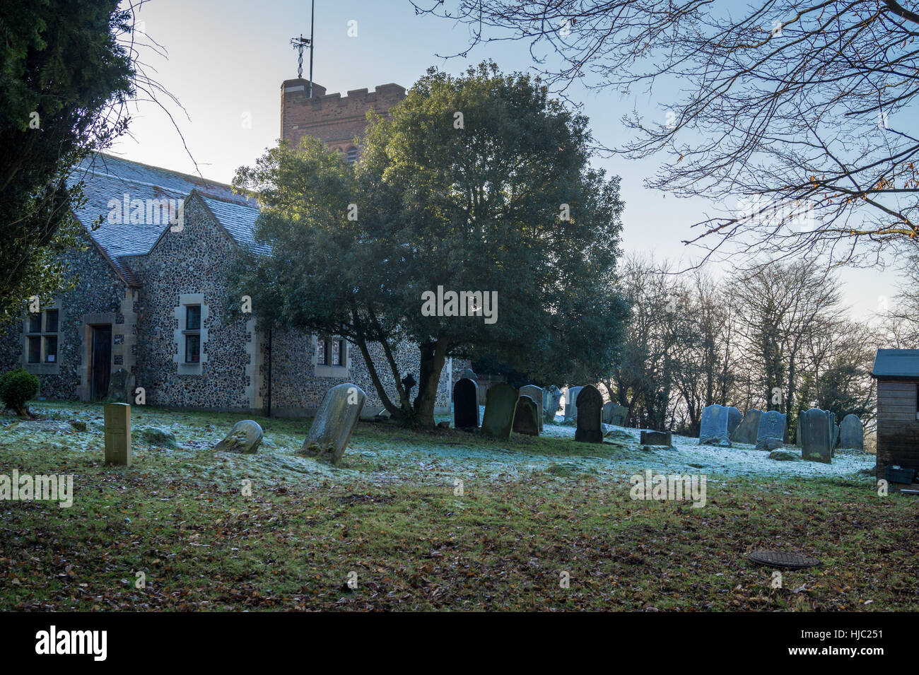 Gravestones in frost, All Saints' Church, Nazeing, Essex, England Stock