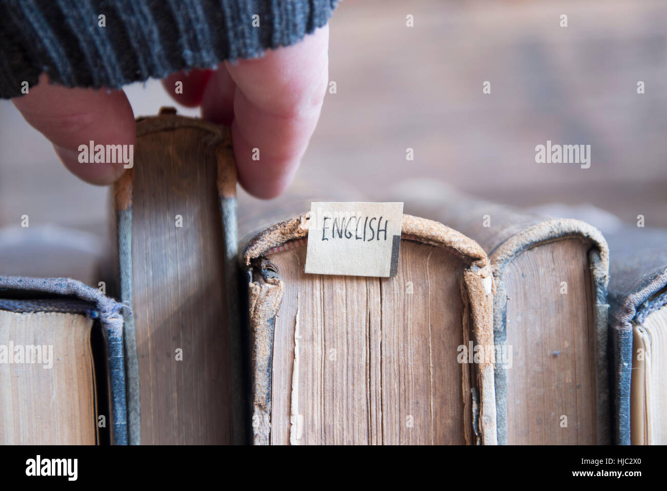Learning english concept, tag and vintage books, soft focus. Toned. Stock Photo