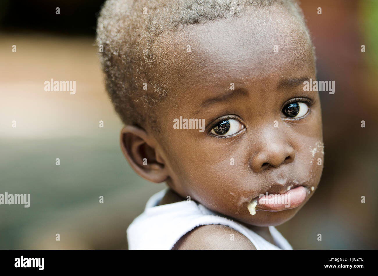 Sadness Despair Depression Symbol: Little African Black Boy Crying Sadly in Bamako, Mali Stock Photo