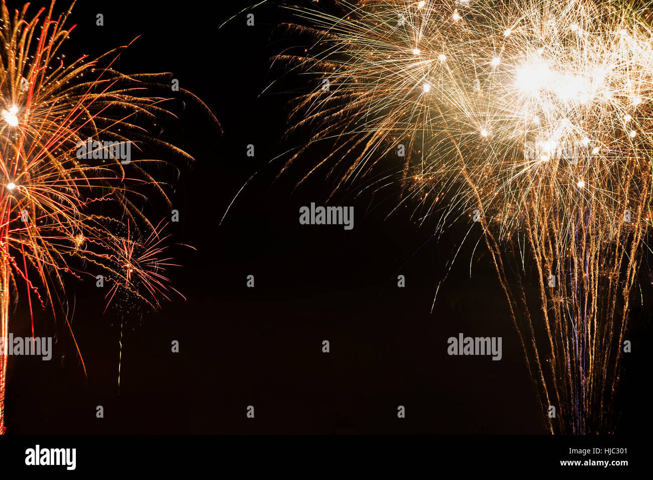 Two abstract fireworks on many locations. Stock Photo