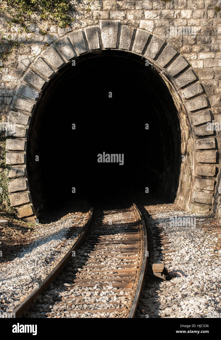 Path is leading into the railway tunnel. Stock Photo