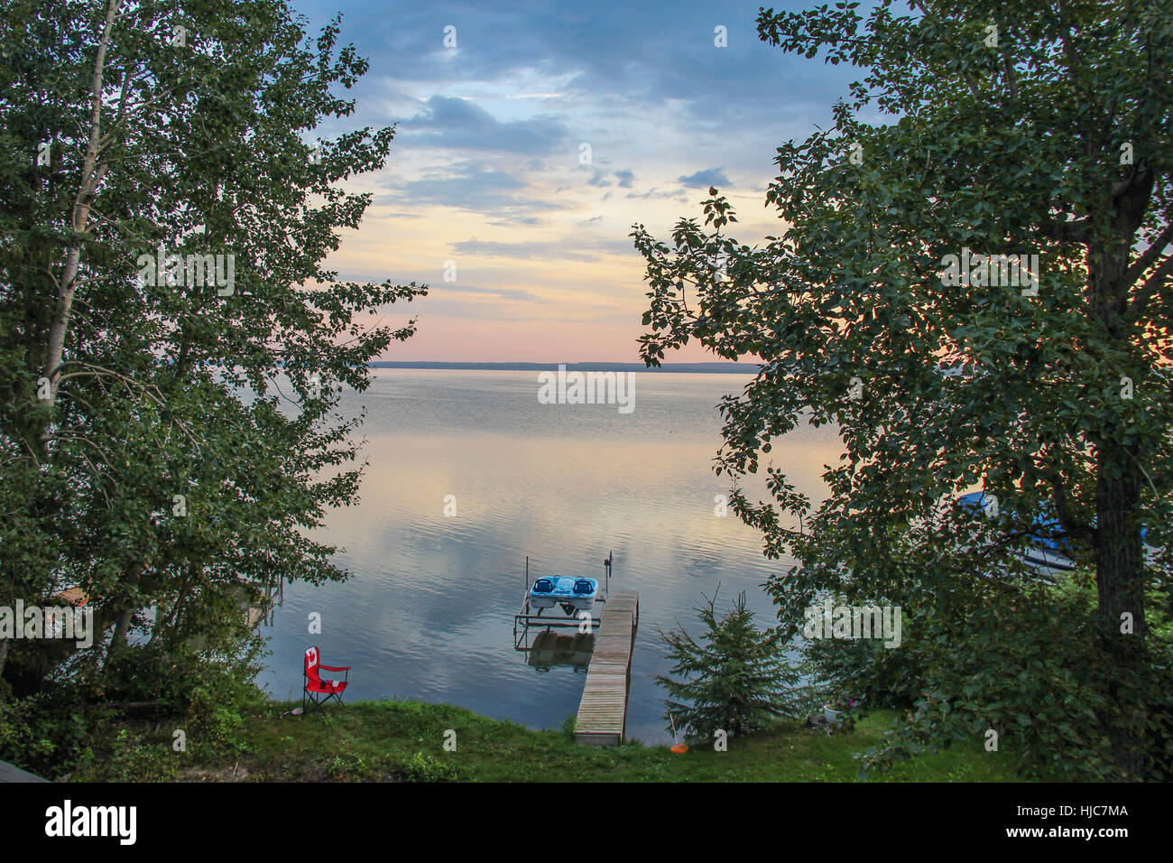 This is my favorite view from my family's cabin at Pigeon Lake in Alberta, Canada.  I visit every summer! Stock Photo