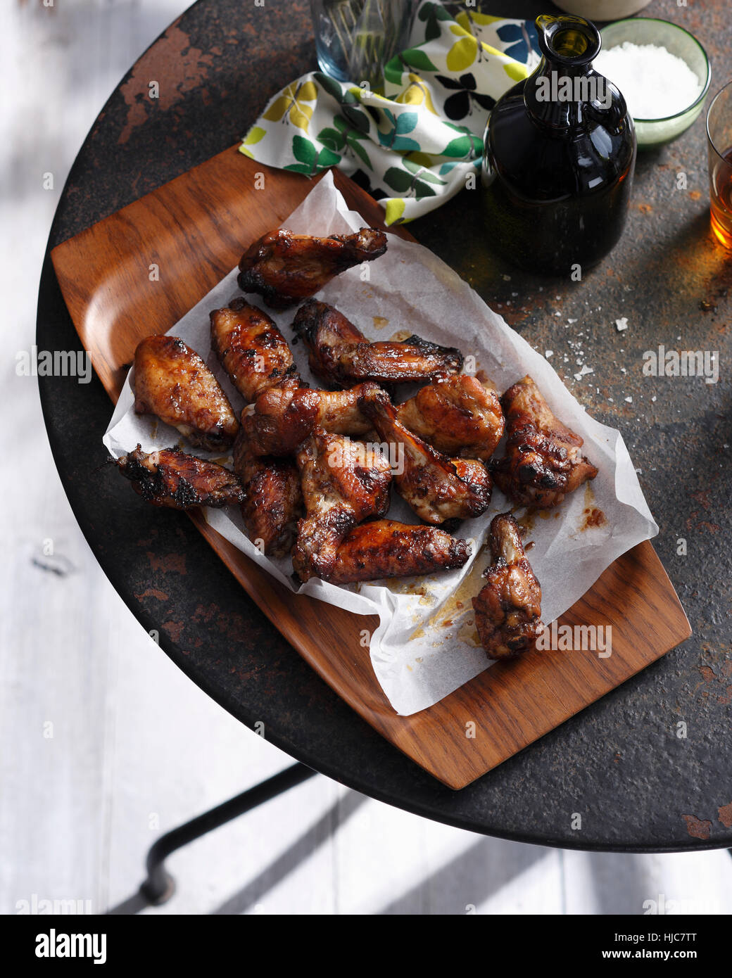 Spicy chicken wings on serving tray Stock Photo