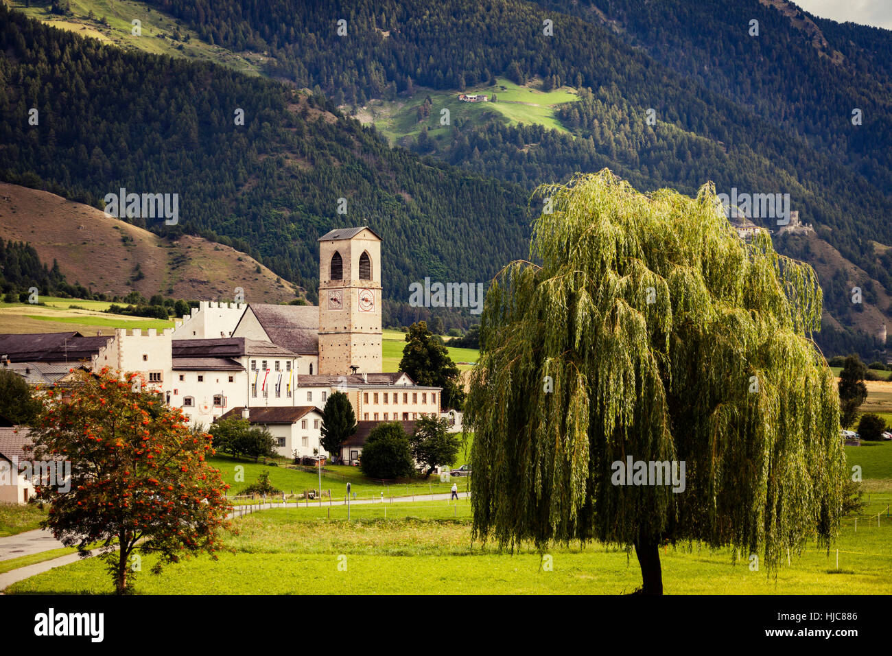 Landscape view of mountain and church, Mustair, Graubunden, Switzerland Stock Photo