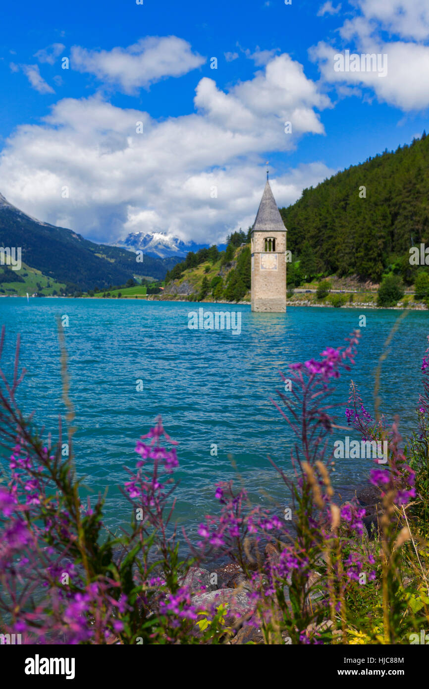 Submerged Curon church bell tower in lake, Vinschgau Valley, South Tyrol, Italy Stock Photo