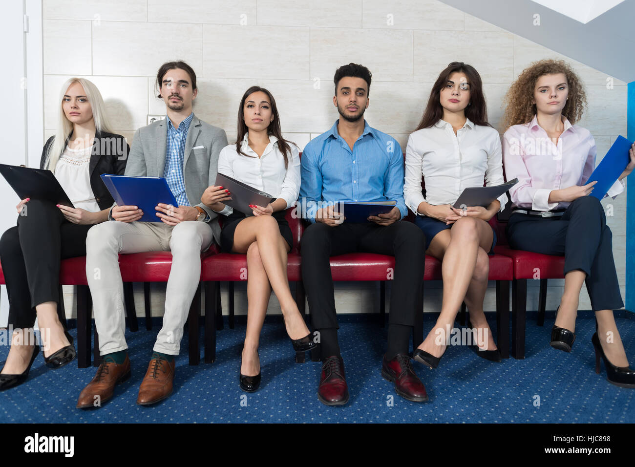 Tired Candidates Wait For Job Interview, Mix Race Business People