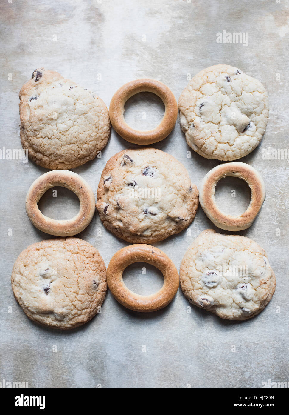 Overhead view of fresh bagels and cookies in square Stock Photo