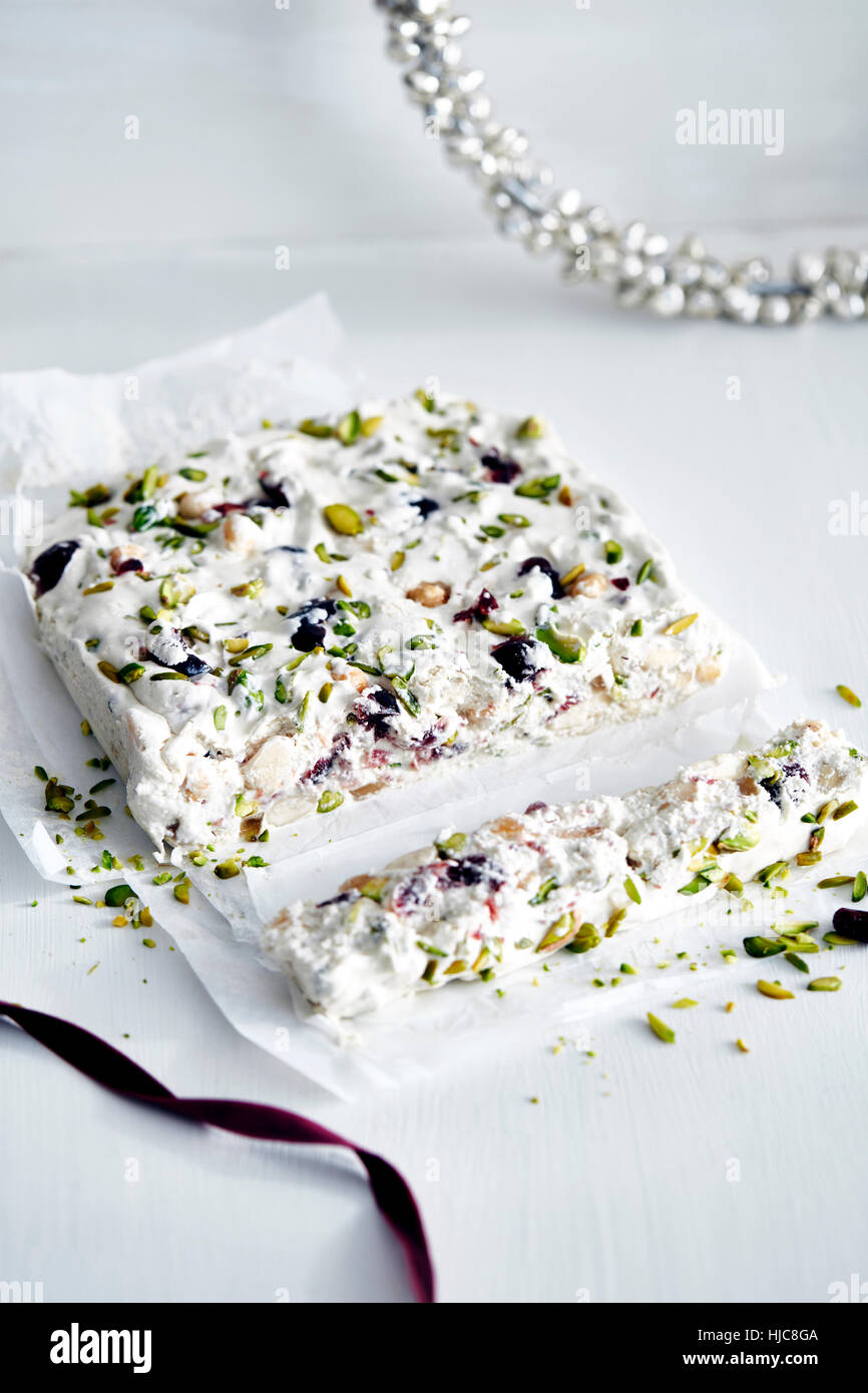 Christmas present of nut and dried fruit nougat Stock Photo Alamy