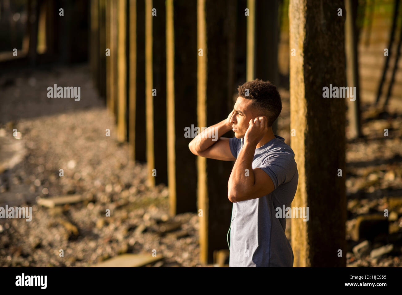 Young man stretching on bridge hi-res stock photography and images - Alamy