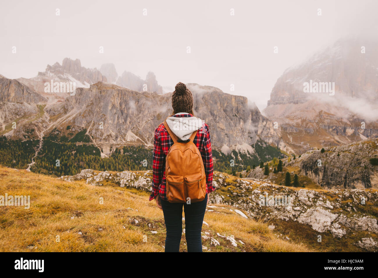 Hiker looking out at Mount Lagazuoi, Dolomite Alps, South Tyrol, Italy Stock Photo