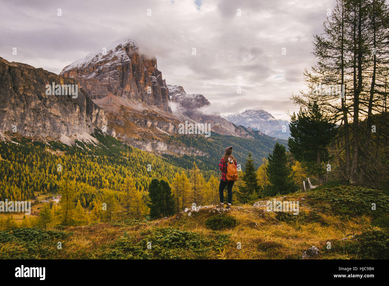 Hiker enjoying scenery, Mount Lagazuoi, Dolomite Alps, South Tyrol, Italy Stock Photo