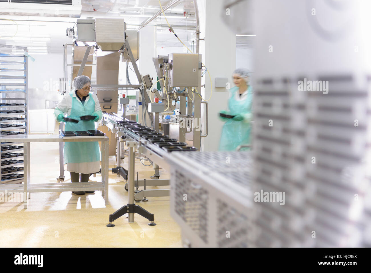 Ready-made meal production line in Asian food factory Stock Photo