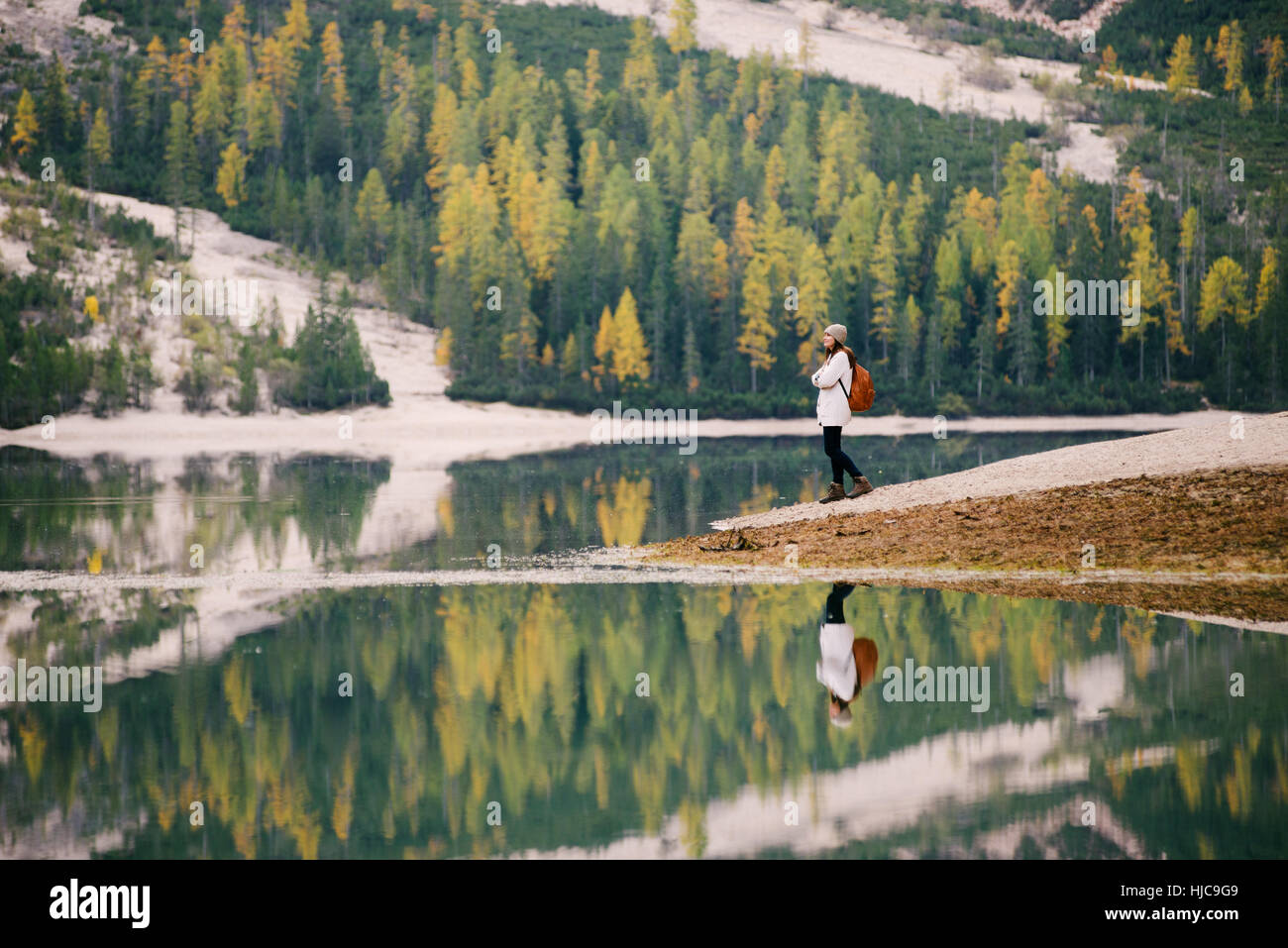 Woman enjoying view, Lago di Braies, Dolomite Alps, Val di Braies, South Tyrol, Italy Stock Photo