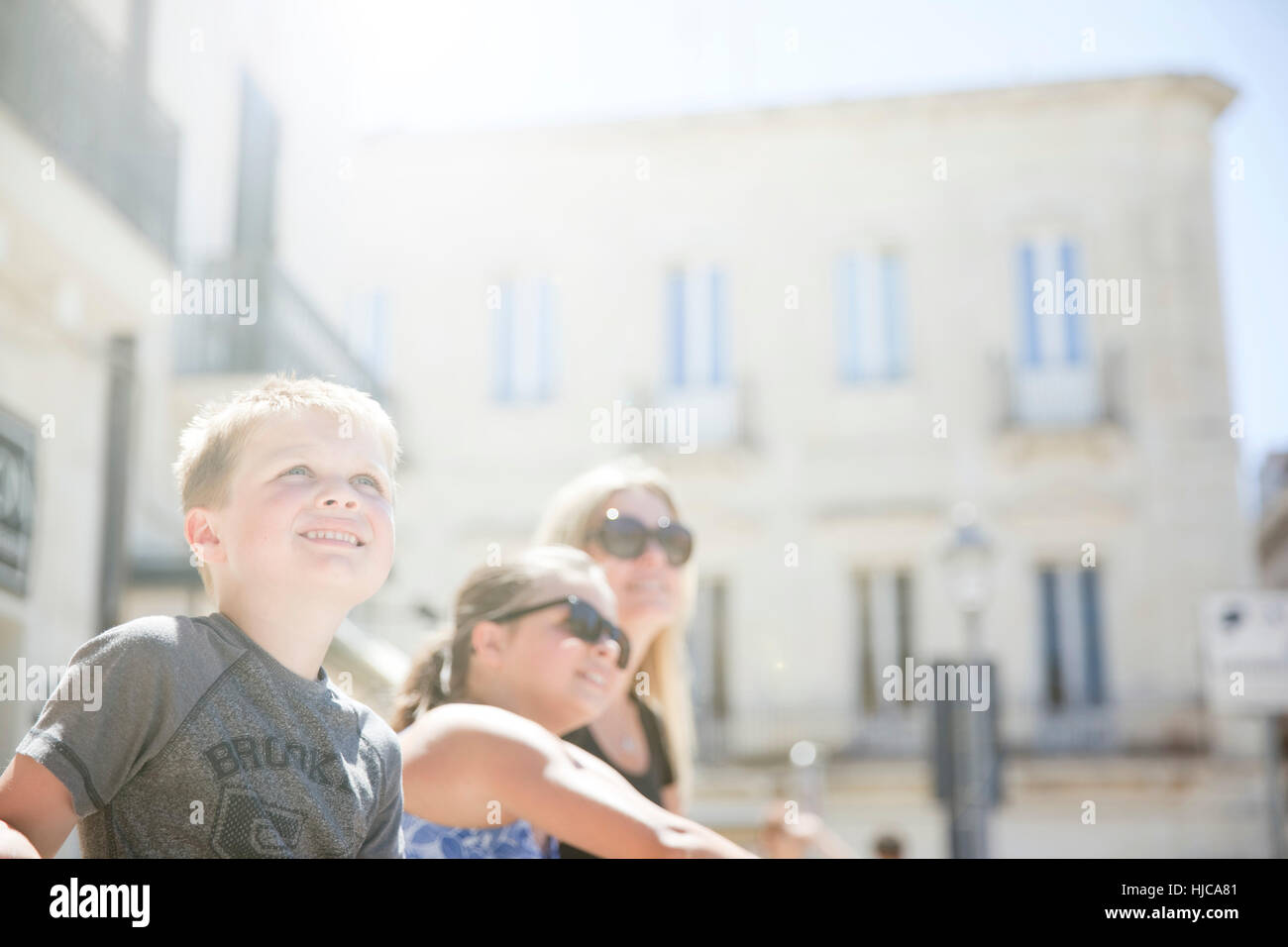 Family sitting in Piazza S. Oronzo, Lecce, Italy Stock Photo