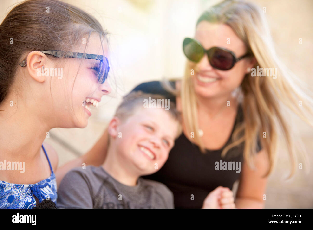 Family hugging and tickling Stock Photo