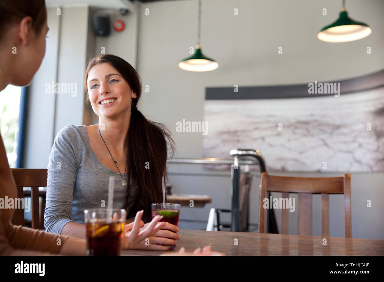 Friends enjoying drinks in pub, London Stock Photo