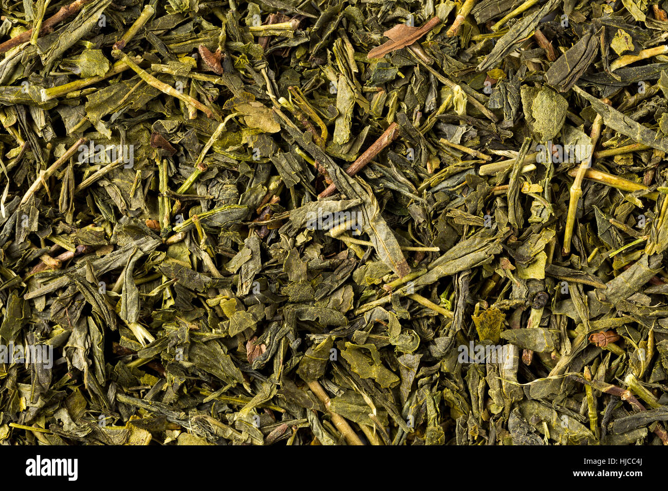 Dried leaves of green japanese bancha tea, full frame, image background. Stock Photo
