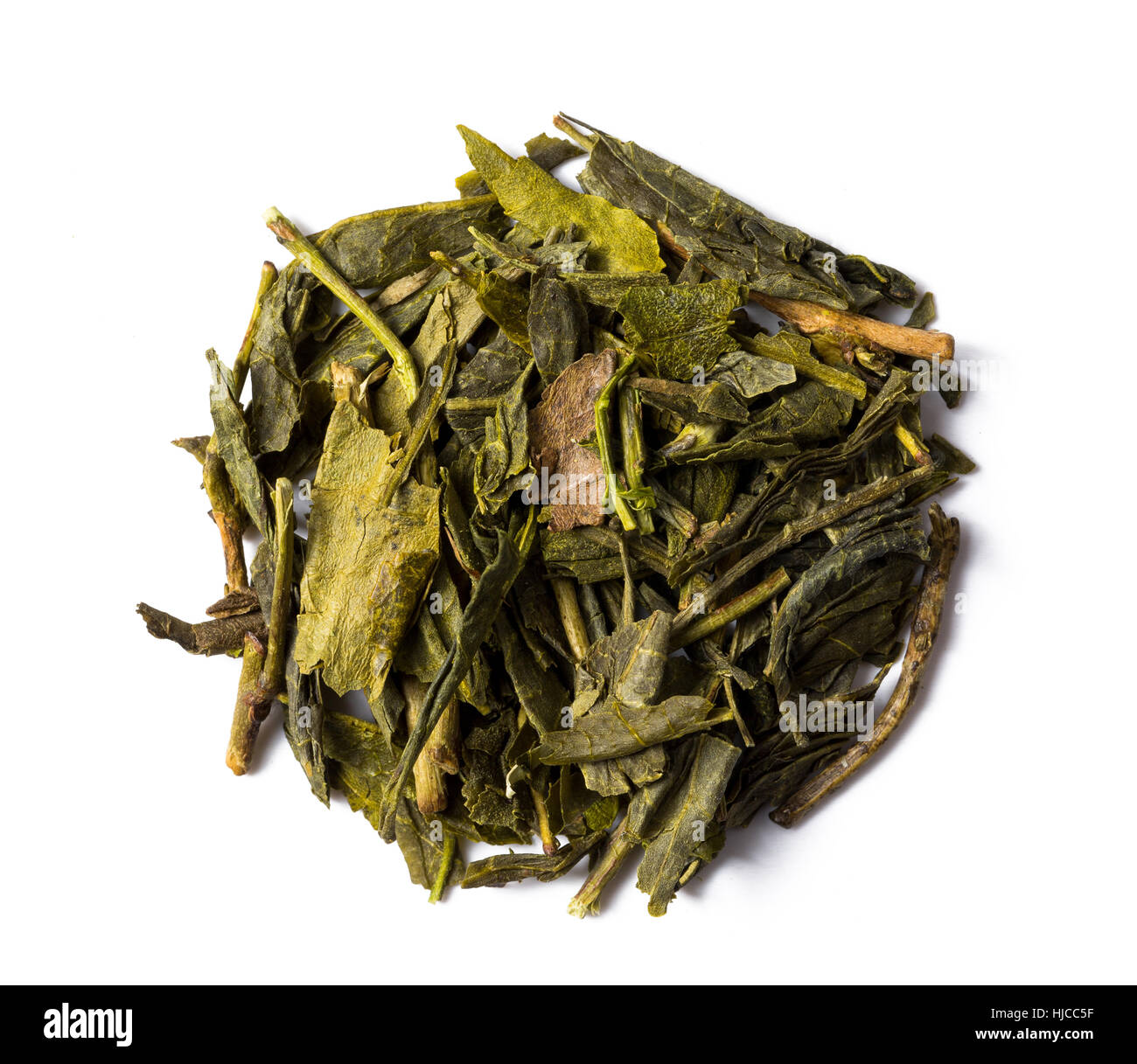 Heap of dried leaves green tea bancha japanese isolated on white background, view from above. Stock Photo