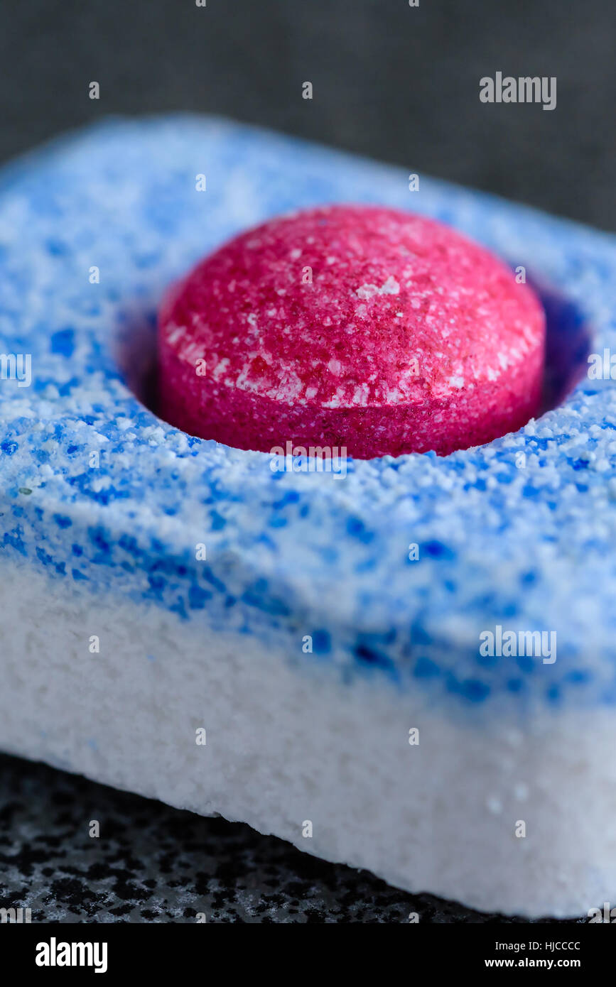 Allinone dishwasher tablet with red ball in center Stock Photo Alamy