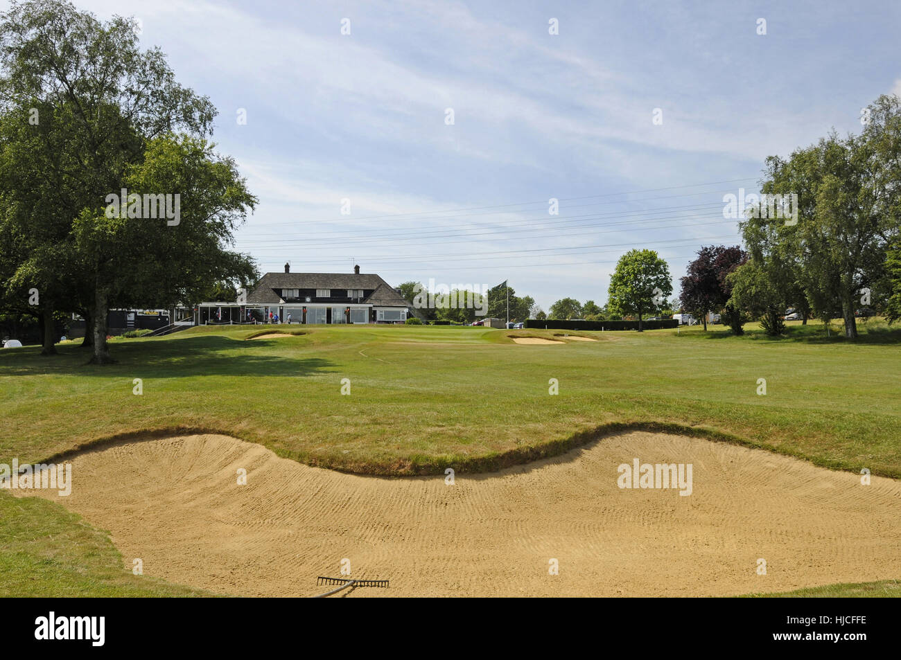 View over Fairway bunker on the 18th Hole to the green and The Clubhouse, Canterbury Golf Club, Canterbury Kent England Stock Photo