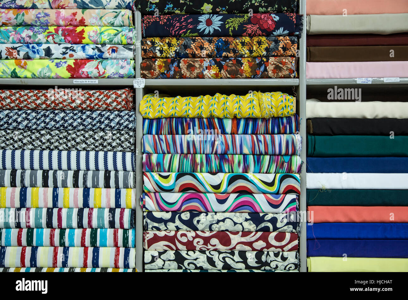 Fabrics display, Yaly Cloth Shop, Hoi An, Vietnam Stock Photo