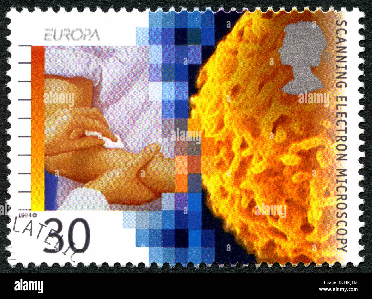 GREAT BRITAIN - CIRCA 1994: A used postage stamp from the UK, commemorating the invention of the Scanning Electron Microscope, circa 1994. Stock Photo