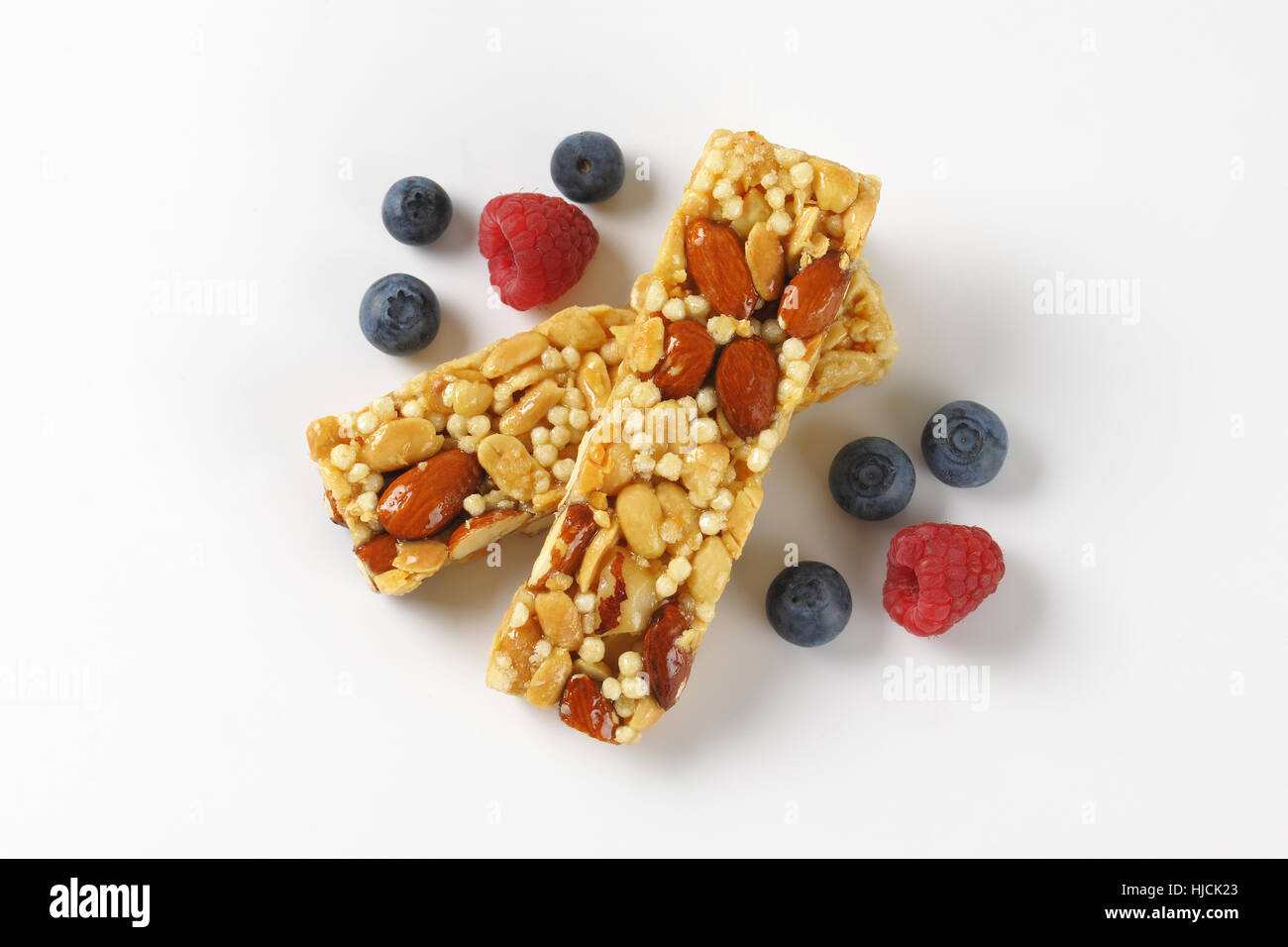 two snack bars with almonds and nuts and berry fruit on white background Stock Photo Alamy