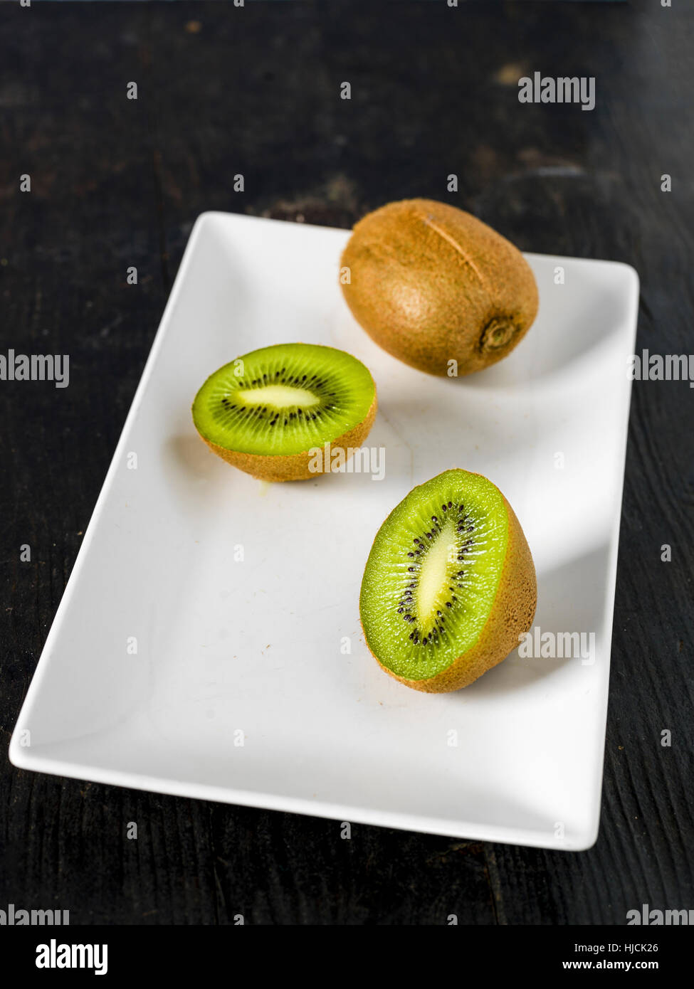 Kiwi Fruit over a dark backround, origin Italy's agriculture Stock