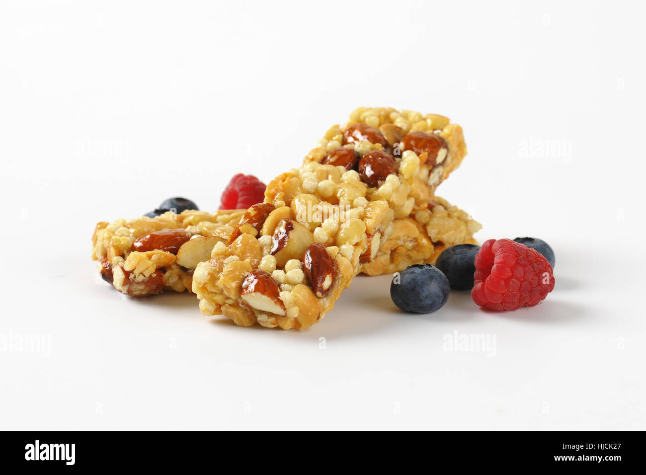 two snack bars with almonds and nuts and berry fruit on white background Stock Photo Alamy