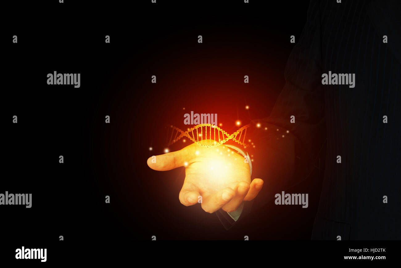 Close up of man holding DNA molecule in palm Stock Photo - Alamy