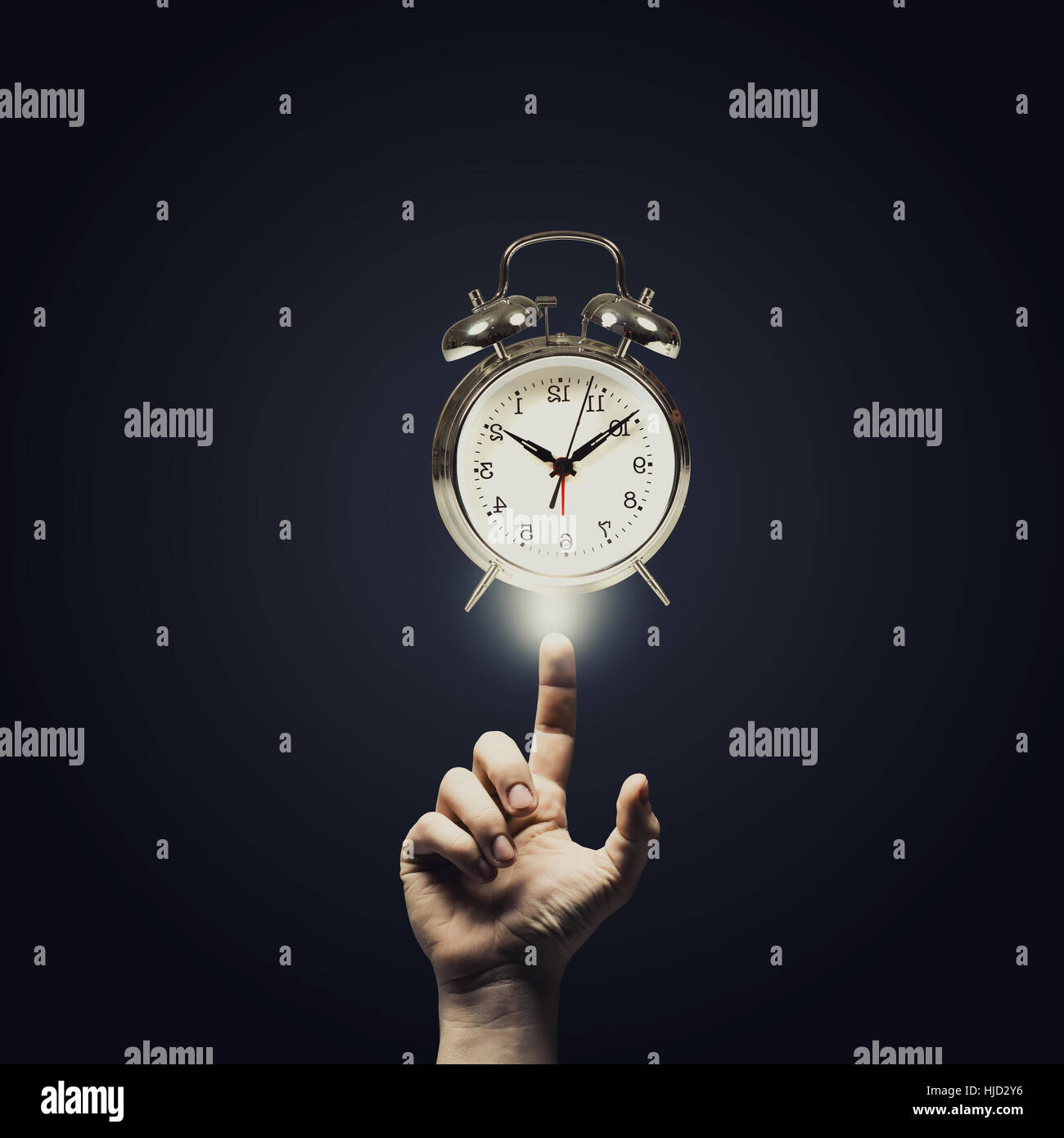 Close up of man hand pointing at clock watch symbol Stock Photo - Alamy
