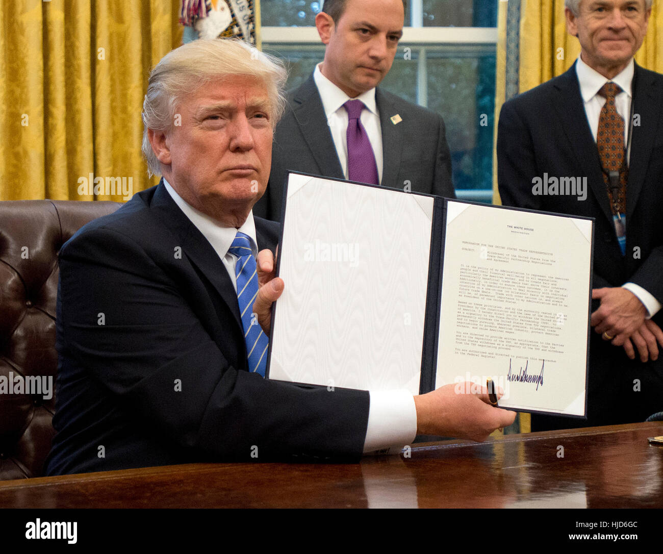 Abortions Overseas. 23rd Jan, 2017. United States President Donald Trump shows the Executive Order withdrawing the US from the Trans-Pacific Partnership (TPP) after signing it in the Oval Office of the White House in Washington, DC on Monday, January 23, 2017. The other two Executive Orders concerned a US Government hiring freeze for all departments but the military, and "Mexico City" which bans federal funding of abortions overseas. Credit: Ron Sachs/Pool via CNP - NO WIRE SERVICE- Photo: Ron Sachs/Consolidated News Photos/Ron Sachs - Pool via CNP/dpa/Alamy Live News Stock Photo