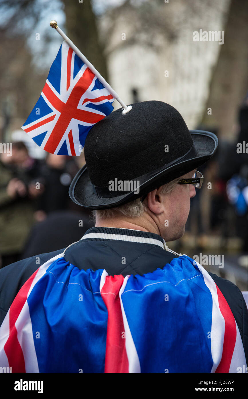 London, UK. 23rd January, 2017. A man wearing a bowler hat and Union Jack flags with pro-Brexit campaigners attending a 'Brexit Peaceful Loud and Proud' rally organised by UKIP outside Downing Street. Campaigners intend to ensure that the EU Referendum vote is implemented. Credit: Mark Kerrison/Alamy Live News Stock Photo