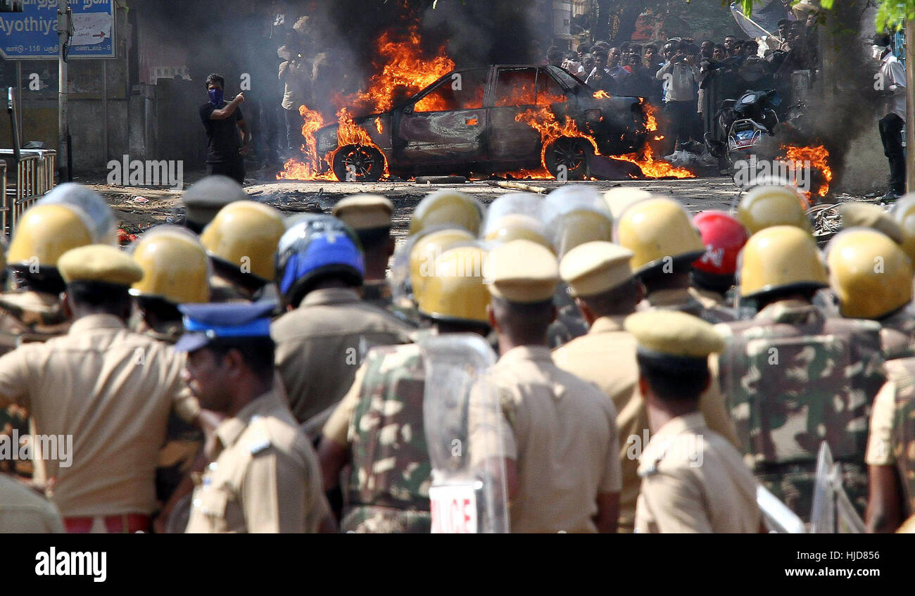 Chennai, India. 23rd Jan, 2017. Vehicles are set on fire during a protest against Jallikattu ban in Chennai, capital of southeastern Indian state of Tamil Nadu on Jan. 23, 2017. The southern Indian state of Tamil Nadu Monday passed a new bill to revive controversial bullfighting sport - Jallikattu. The bill was unanimously passed by legislators in the state's lawmaking body, thereby replacing an ordinance passed last week to resume the sport. Credit: Stringer/Xinhua/Alamy Live News Stock Photo