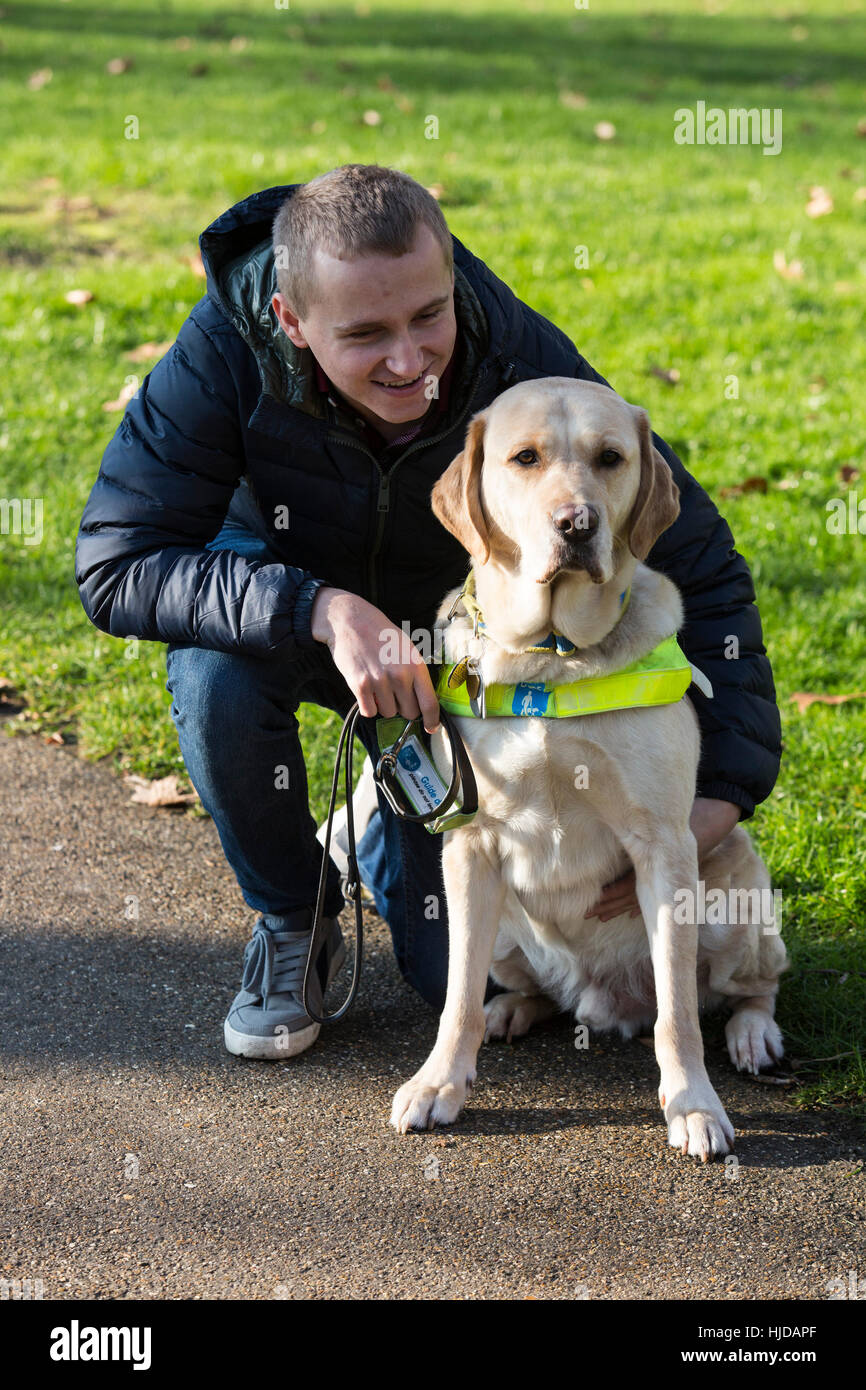 London, UK. 24th Jan, 2017. Hudson, the Labrador Retriever guide dog with owner Nathan Edge, 22, from North Hykeham, Lincs. The Kennel Club and Eukanuba have selected four inspiring Hero Dogs as the 2017 finalists. They forward to the public vote with the winner being announced at Crufts. Credit: Vibrant Pictures/Alamy Live News Stock Photo