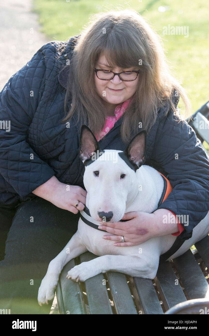 London, UK. 24th Jan, 2017. Bowser, the Bull Terrier, with owner Sally Degan, 26, from Scunthorpe, Lincs. The Kennel Club and Eukanuba have selected four inspiring Hero Dogs as the 2017 finalists. They forward to the public vote with the winner being announced at Crufts. Credit: Vibrant Pictures/Alamy Live News Stock Photo