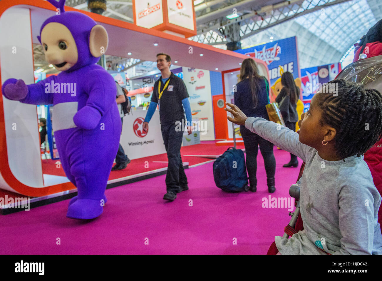 London, UK. 24th Jan, 2017. The Teletubbies celebrate their 20th anniversary but dont see a young admirer - The London Toy Fair opens at Olympia exhibition centre. Organised by the British Toy and Hobby Association it is the only dedicated toy, game and hobby trade exhibition in the UK. It runs for three days, with more than 240 exhibiting companies ranging from the large internationals to the new start up companies. London 24/01/17 Credit: Guy Bell/Alamy Live News Stock Photo
