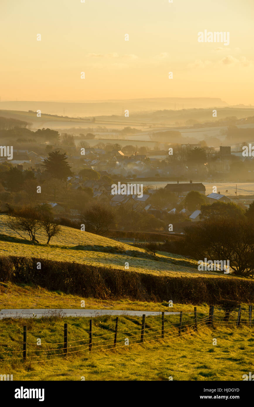 Clear sunrise from Abbotsbury Hill, near Abbotsbury, Dorset, UK. 25th January 2017. A Colourful winter sunrise from Abbotsbury Hill looking towards Abbotsbury. © Dan Tucker/Alamy Live News Stock Photo