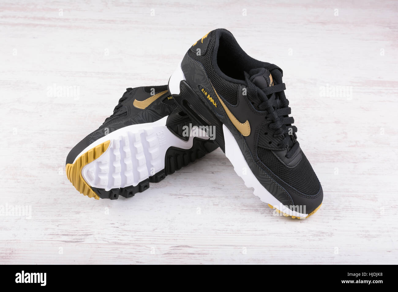 BURGAS, BULGARIA - DECEMBER 29, 2016: Nike Air MAX women's shoes - sneakers  in black, on white wooden background Stock Photo - Alamy