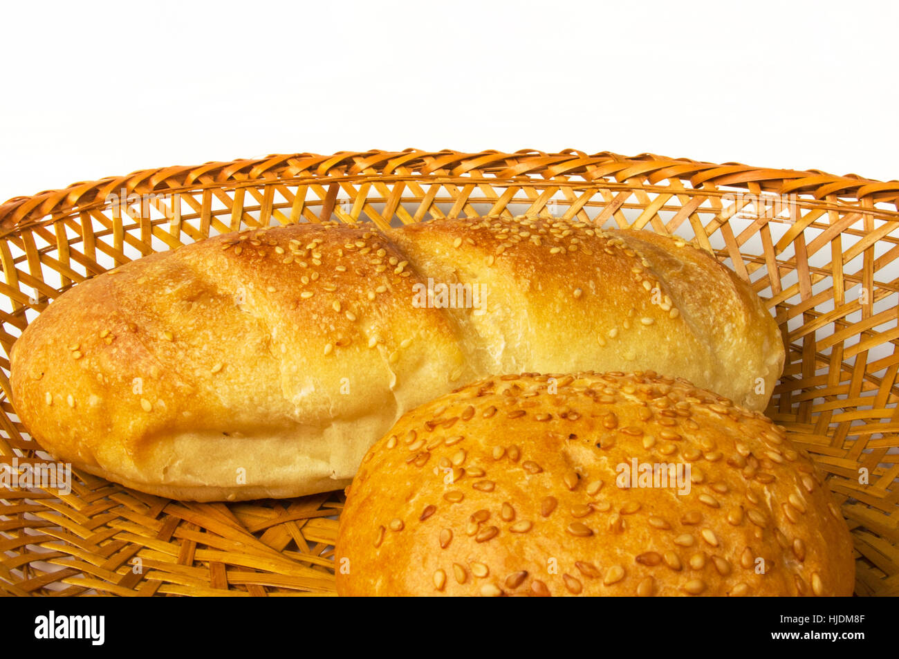 whole wheat bread and bun on a wicker plate Stock Photo - Alamy