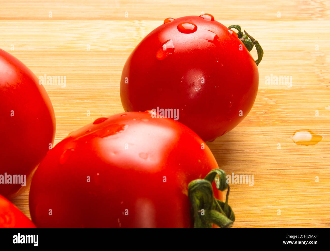 still life - ripe small tomatoes on wooden background Stock Photo