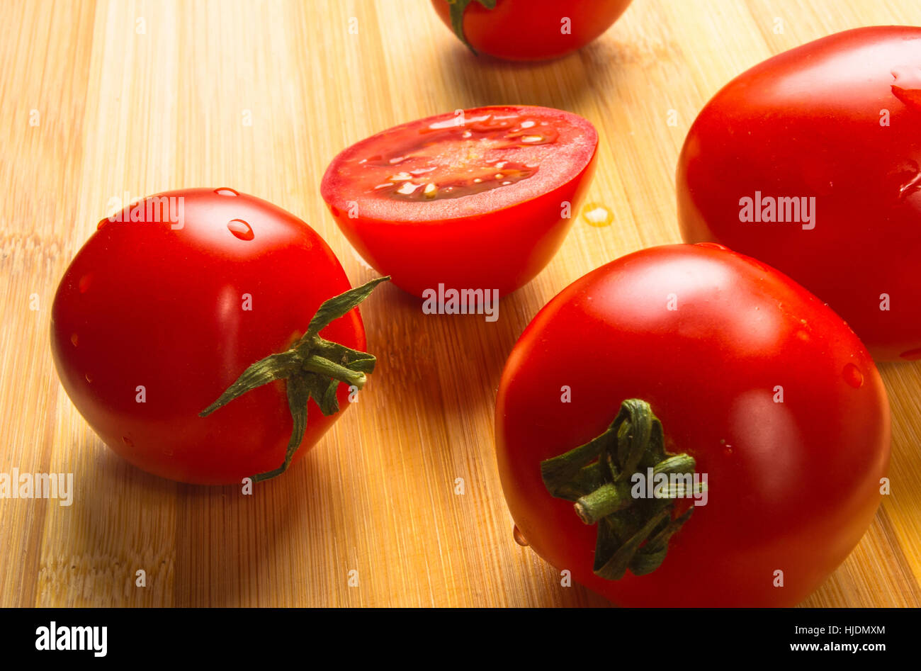 still life - ripe small tomatoes on wooden background Stock Photo