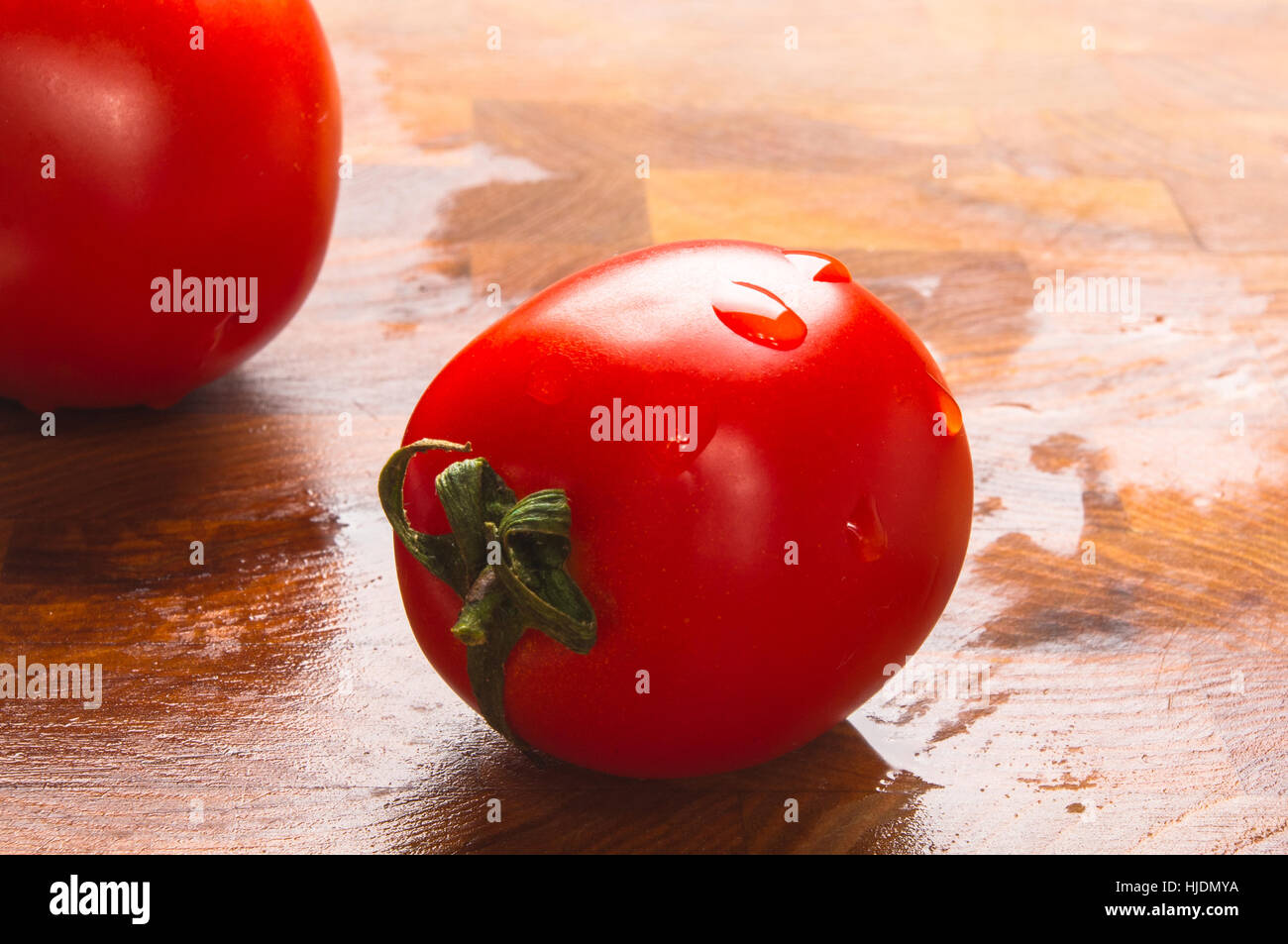 still life - ripe small tomatoes on wooden background Stock Photo