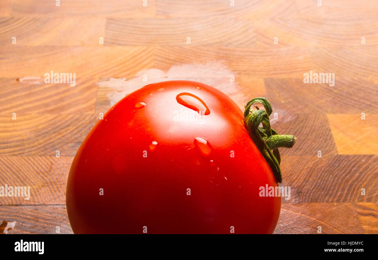 still life - ripe small tomatoes on wooden background Stock Photo