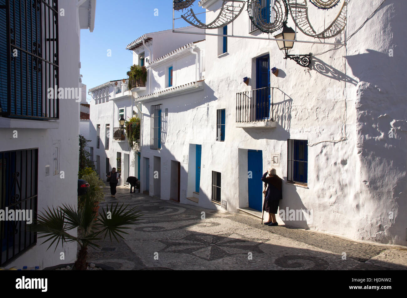 Local woman standing by her house in Frigiliana, Sp;ain Stock Photo