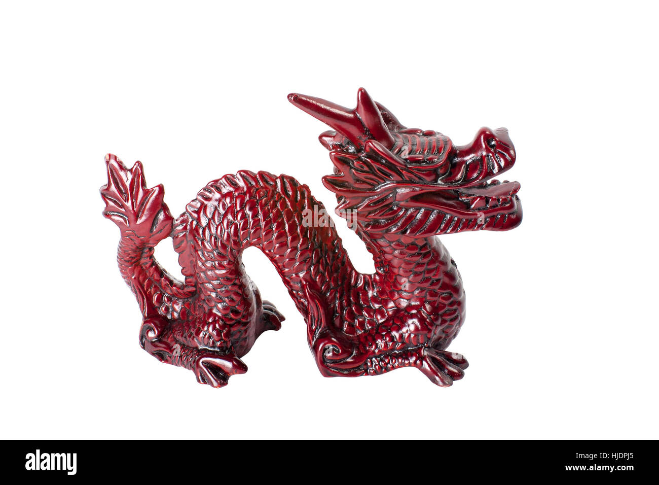 Brown traditional chinese dragon isolated on white background. Feng Shui statuette. Stock Photo