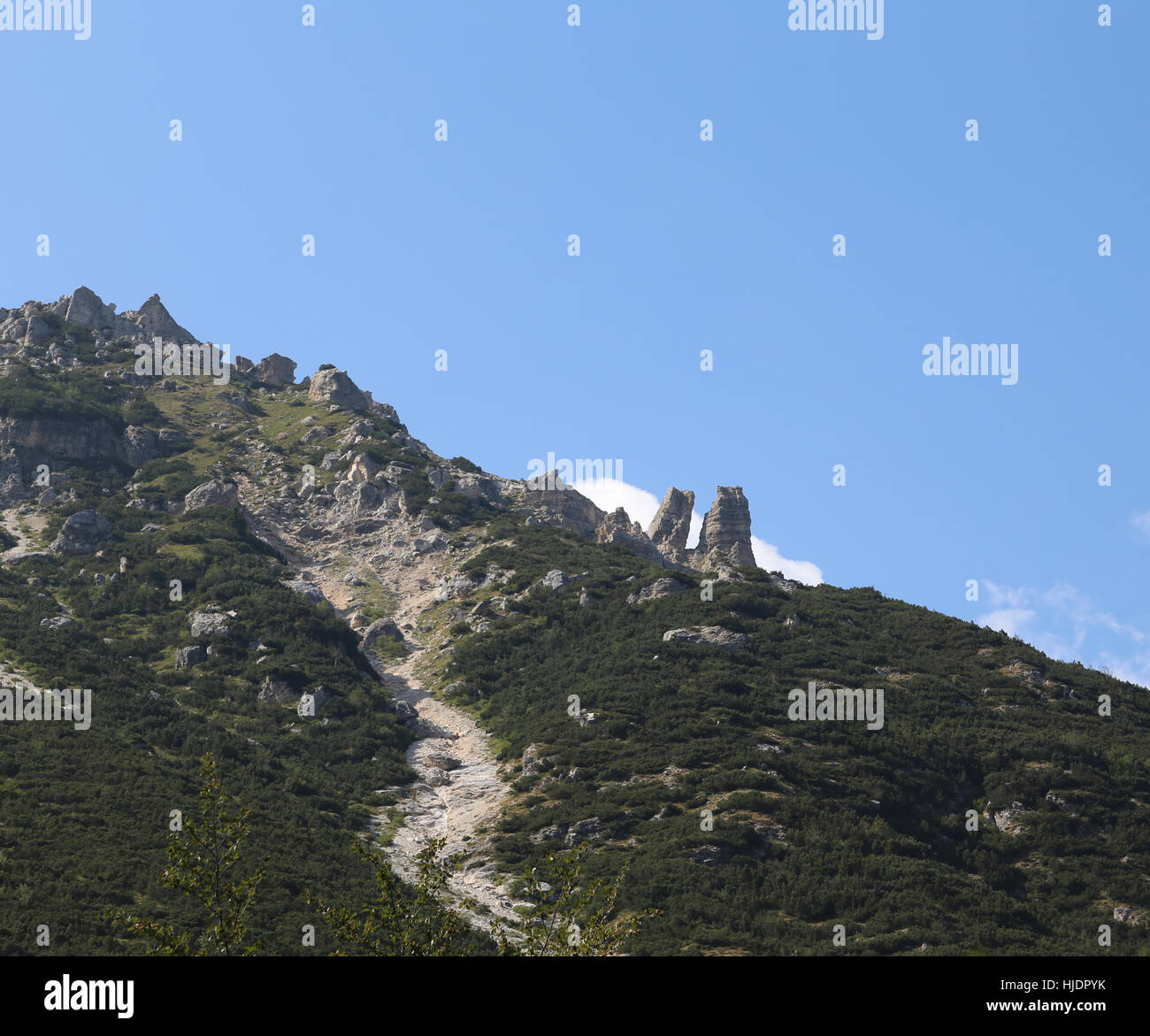 italian foothills with two spikes rock called in Venetian dialect OMO e DONA that means the man and the woman Stock Photo
