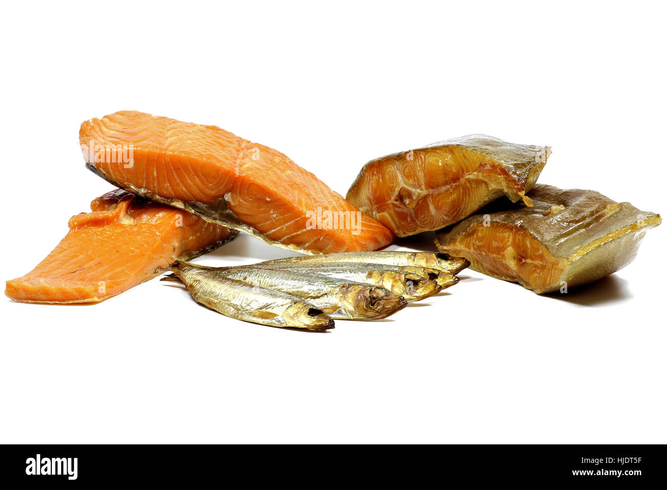 assortment of smoked fish varieties isolated on white background Stock