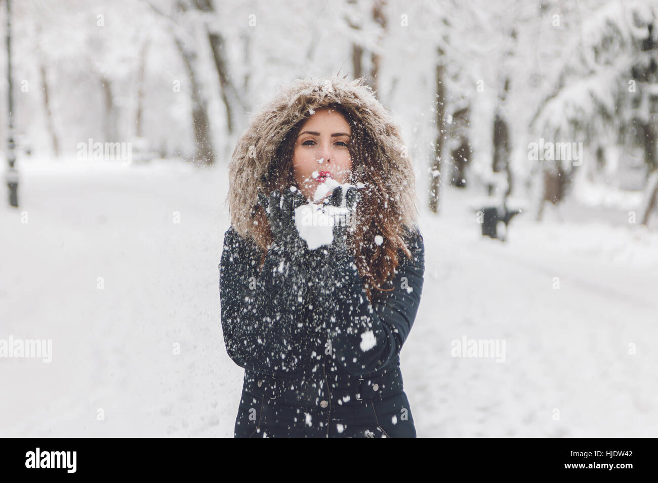 Winter portrait of a beautiful woman in the snowfall Stock Photo - Alamy